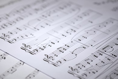 Photo of Sheet with musical notes as background, closeup
