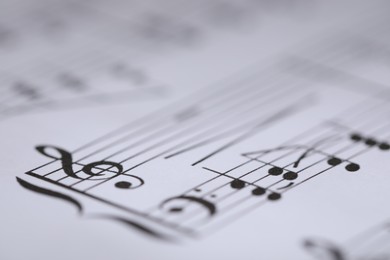 Photo of Sheet with musical notes as background, closeup