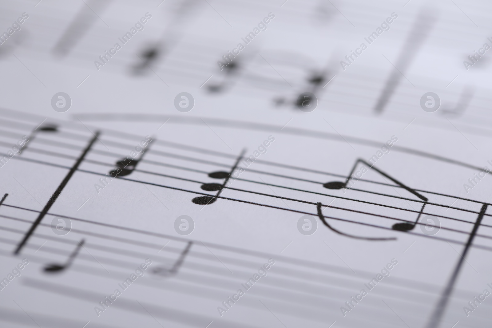 Sheet with musical notes as background, closeup Photo of Sheet with musical notes as background, closeup