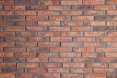 Photo of Texture of red brick wall as background, closeup