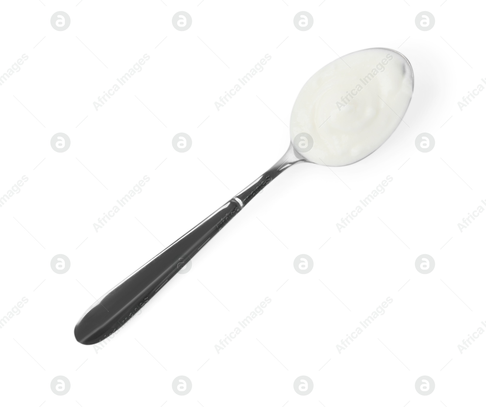 Tasty yoghurt in spoon isolated on white, top view Photo of Tasty yoghurt in spoon isolated on white, top view