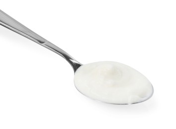 Photo of Tasty yoghurt in spoon isolated on white