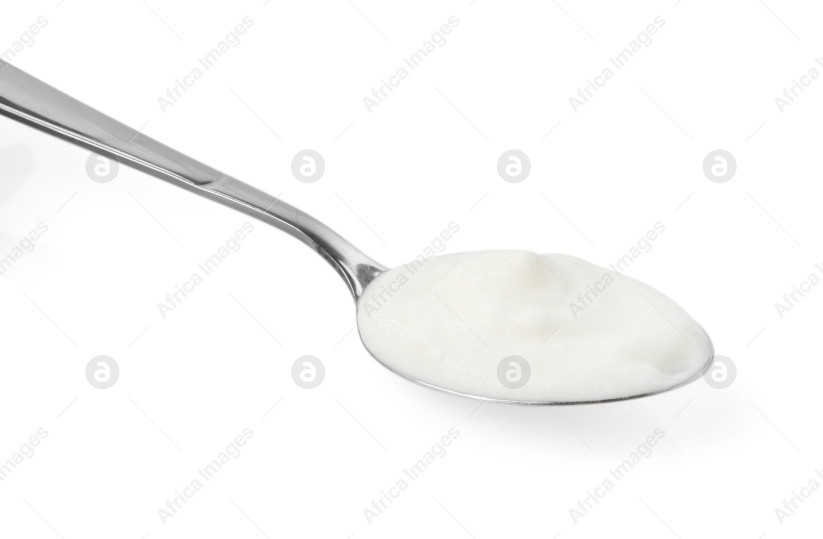 Photo of Tasty yoghurt in spoon isolated on white