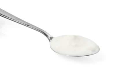 Photo of Tasty yoghurt in spoon isolated on white