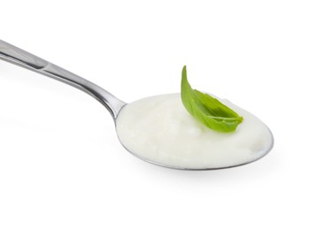Photo of Tasty yoghurt with basil in spoon isolated on white