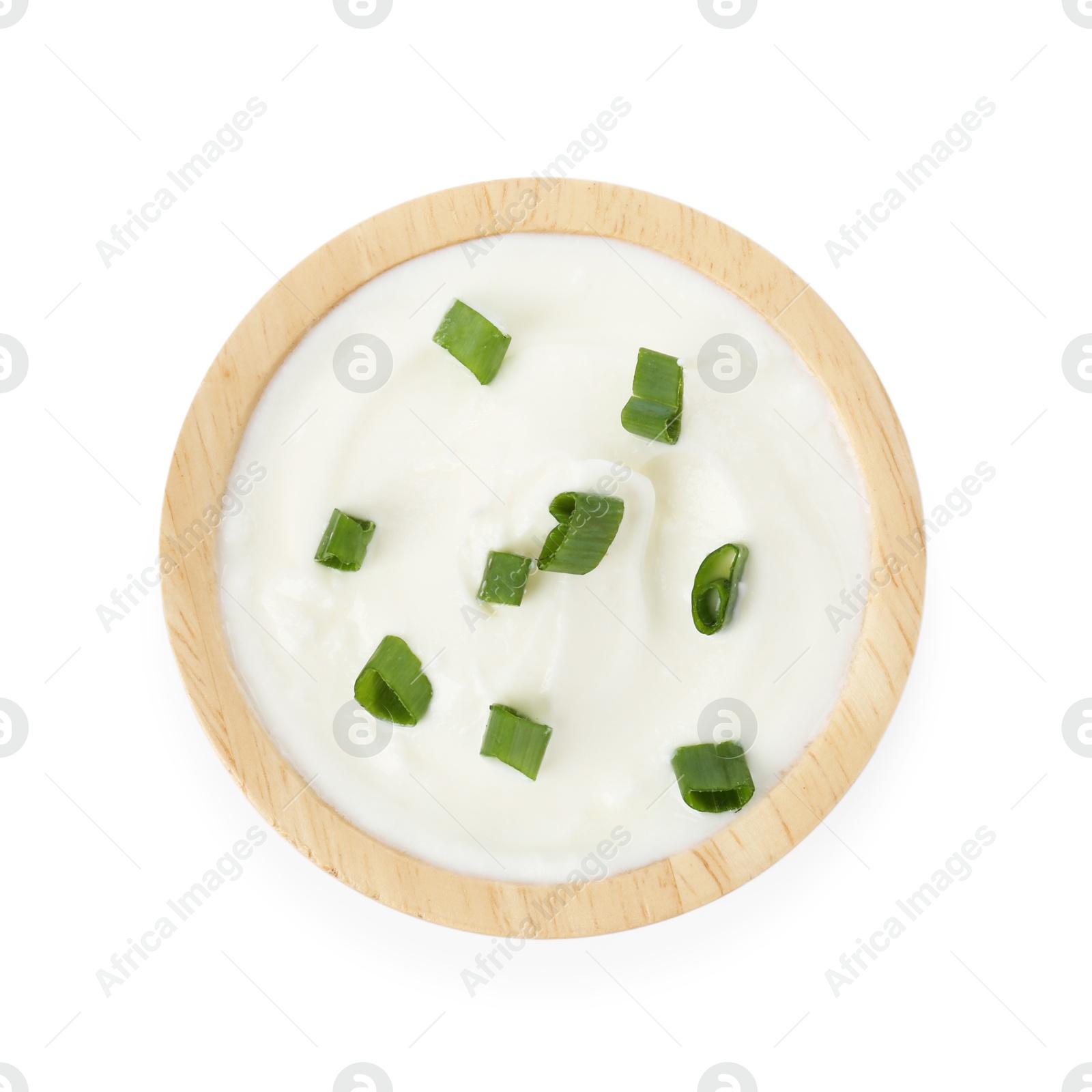 Photo of Tasty yoghurt with green onions in bowl isolated on white, top view