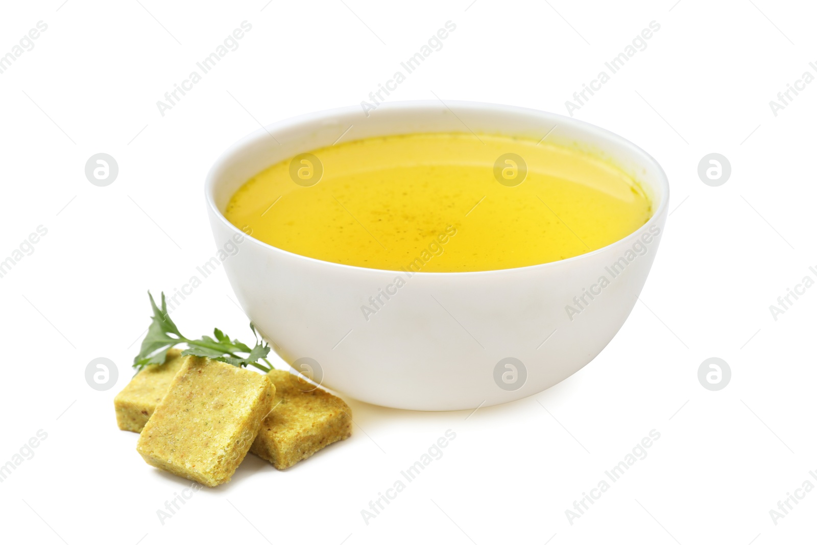 Aromatic bouillon cubes, broth and parsley isolated on white Photo of Aromatic bouillon cubes, broth and parsley isolated on white