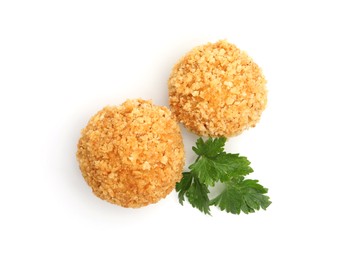 Photo of Delicious fried croquette balls and parsley isolated on white, top view