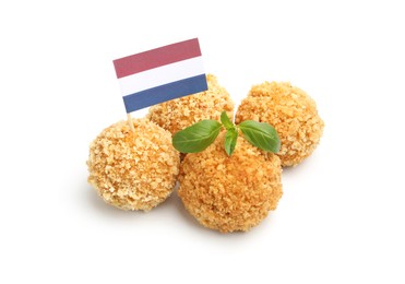 Photo of Delicious fried croquette balls, basil and small flag of Netherlands isolated on white