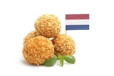 Photo of Delicious fried croquette balls, basil and small flag of Netherlands isolated on white