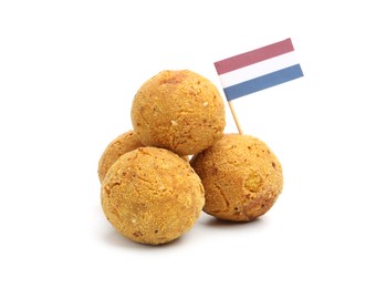 Photo of Delicious fried croquette balls and small flag of Netherlands isolated on white