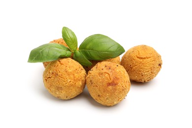 Photo of Delicious fried croquette balls and basil isolated on white
