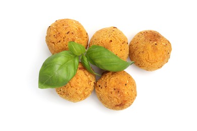 Photo of Delicious fried croquette balls and basil isolated on white, top view