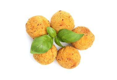 Photo of Delicious fried croquette balls and basil isolated on white, top view