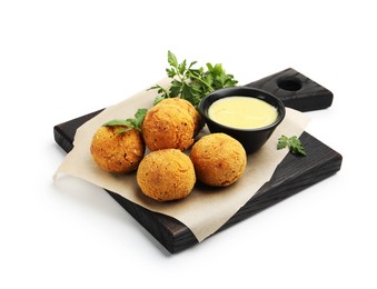 Photo of Delicious fried croquette balls with parsley and sauce isolated on white