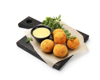 Photo of Delicious fried croquette balls with parsley and sauce isolated on white