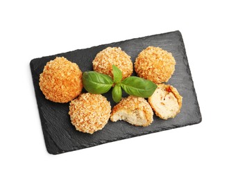 Photo of Delicious fried croquette balls with basil isolated on white, top view