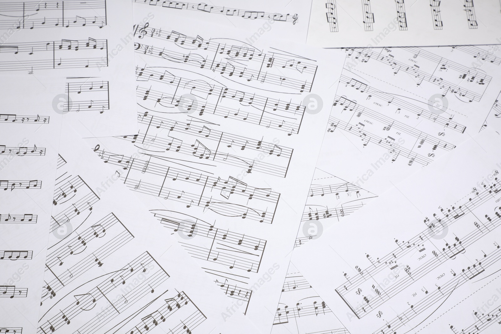 Sheets with musical notes as background, closeup Photo of Sheets with musical notes as background, closeup