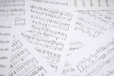 Photo of Sheets with musical notes as background, closeup