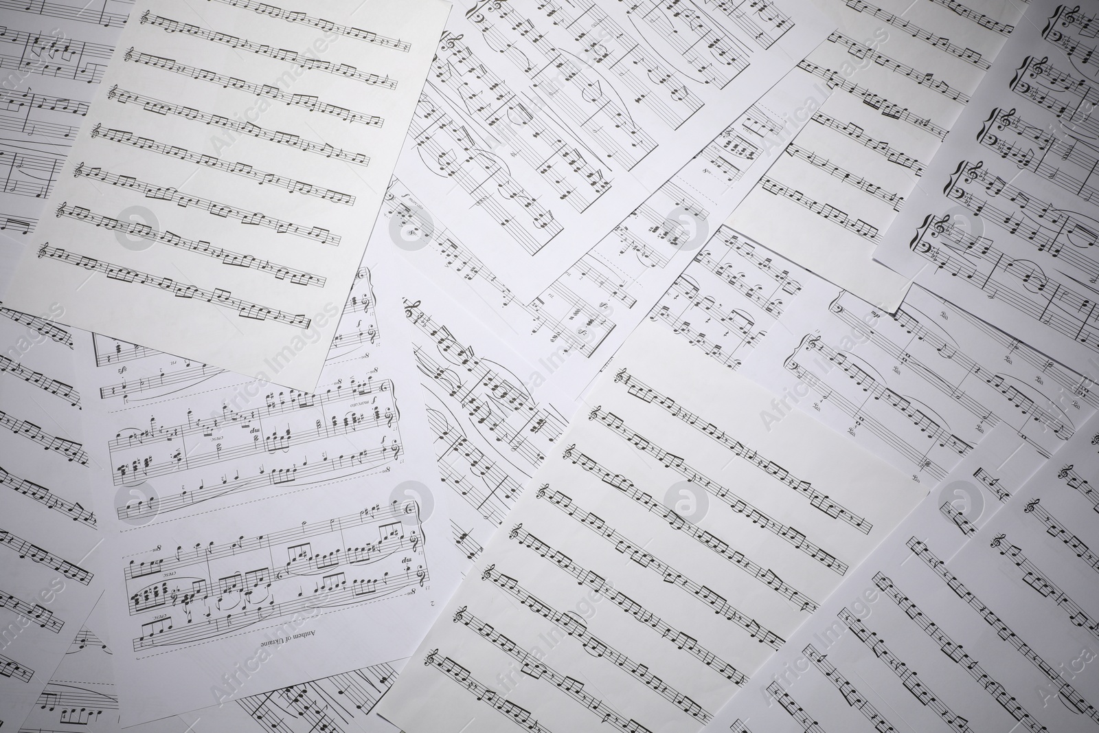 Sheets with musical notes as background, top view Photo of Sheets with musical notes as background, top view