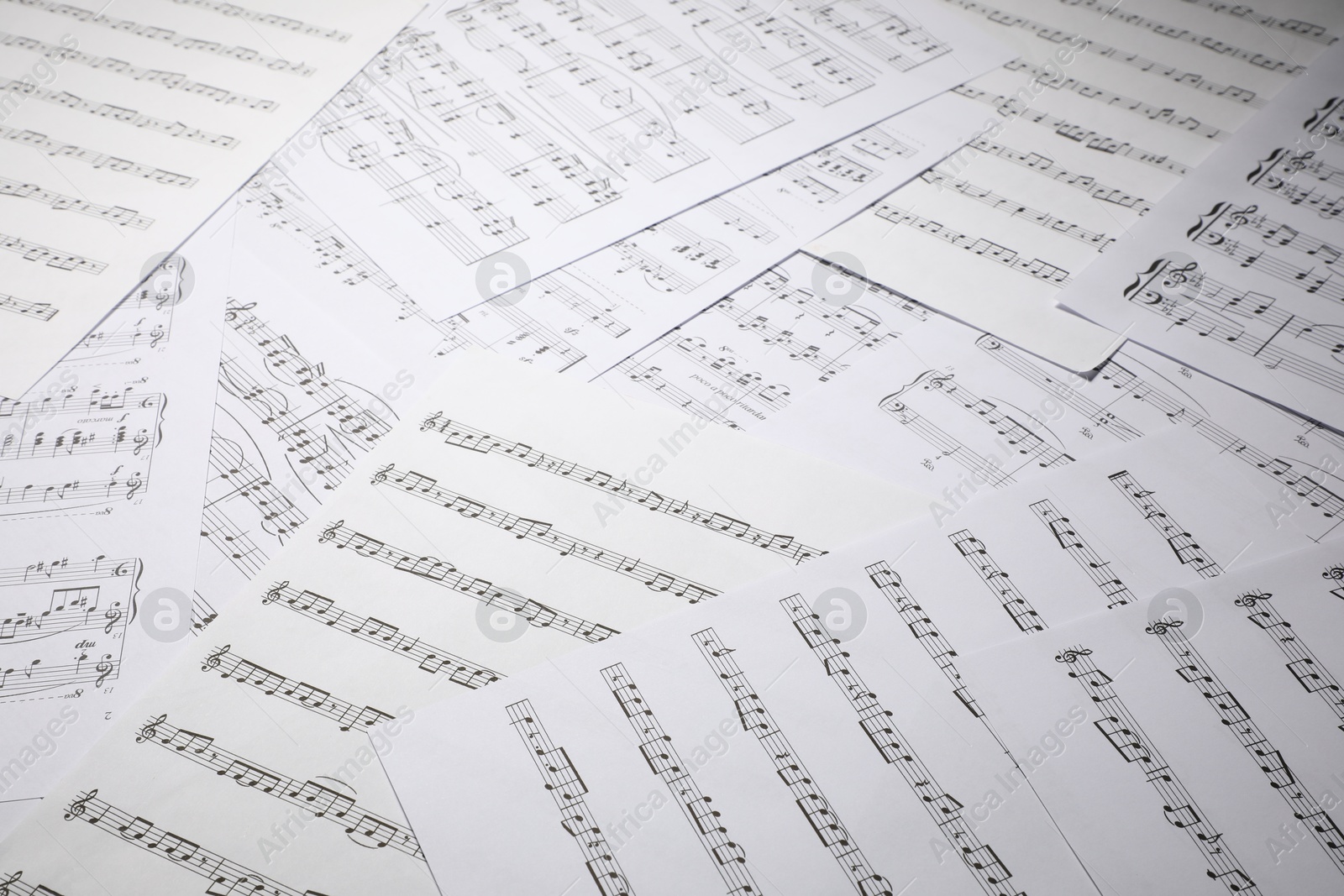 Sheets with musical notes as background, closeup Photo of Sheets with musical notes as background, closeup