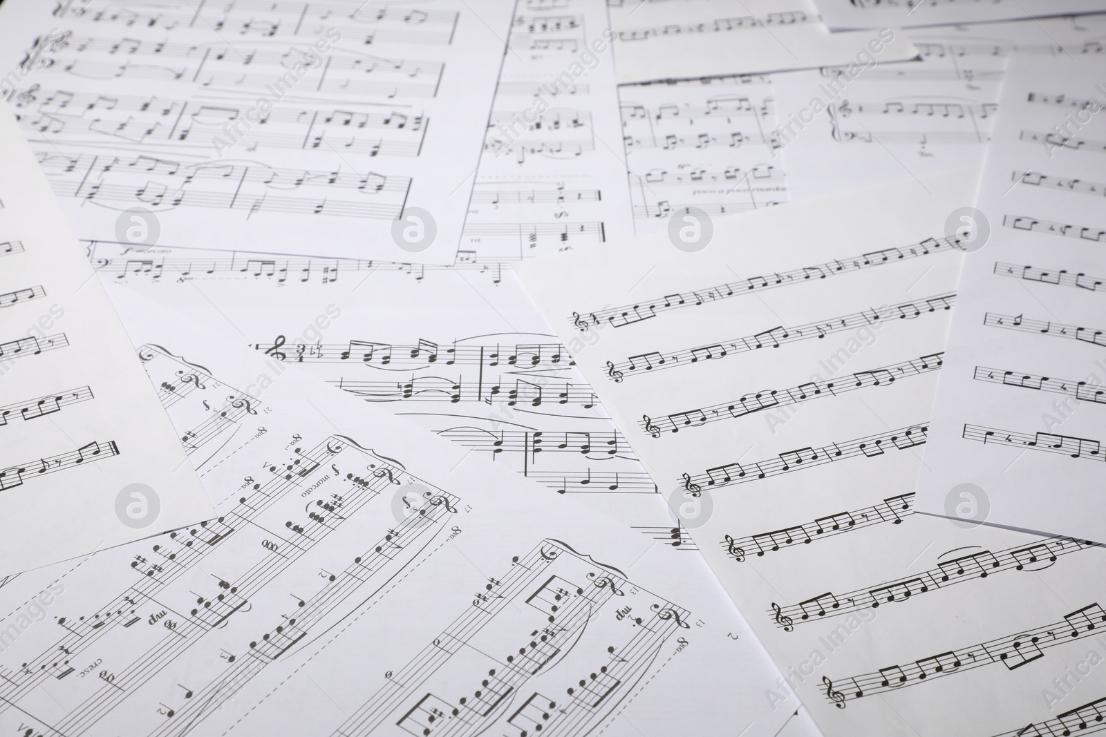Sheets with musical notes as background, closeup Photo of Sheets with musical notes as background, closeup