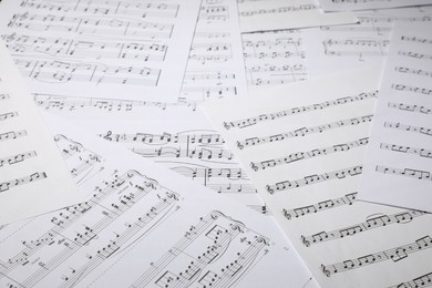 Photo of Sheets with musical notes as background, closeup