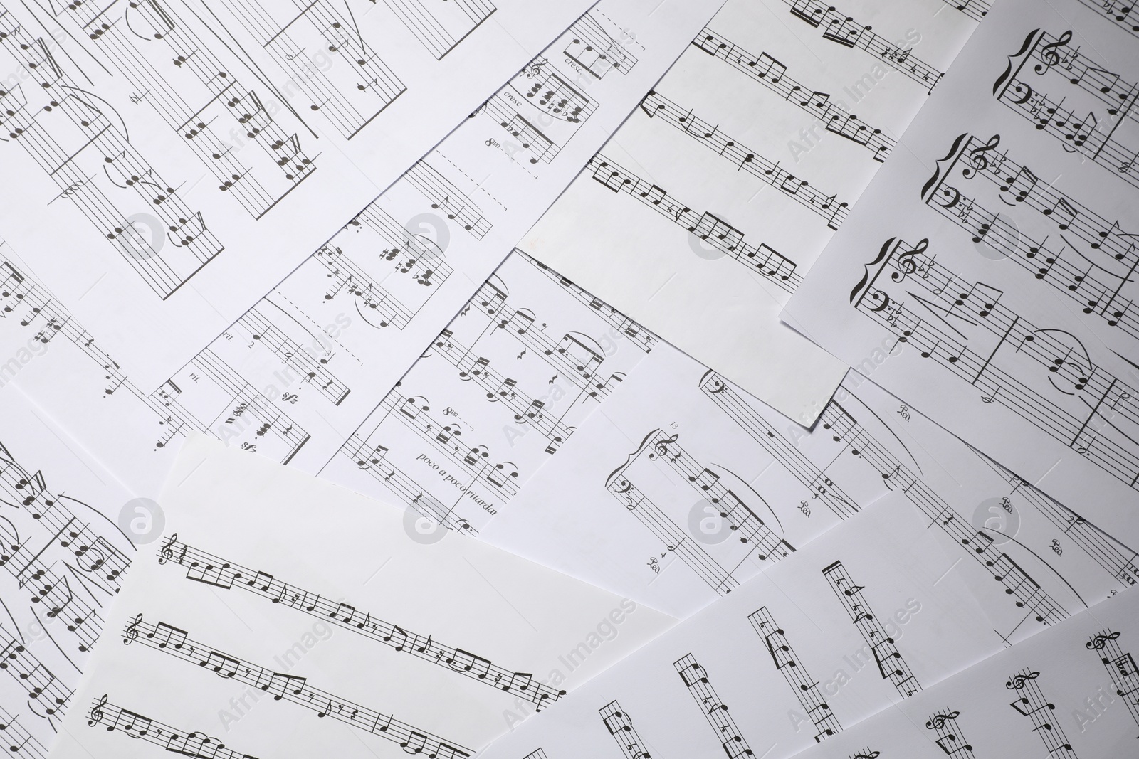 Sheets with musical notes as background, closeup Photo of Sheets with musical notes as background, closeup