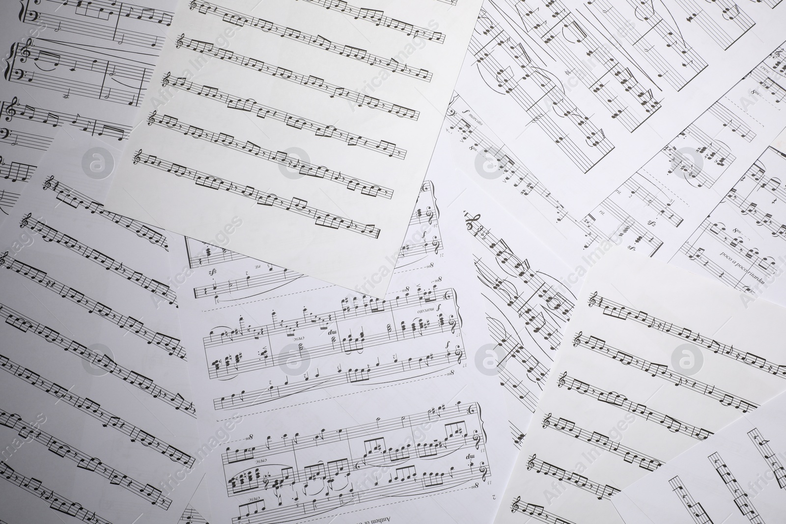 Sheets with musical notes as background, top view Photo of Sheets with musical notes as background, top view