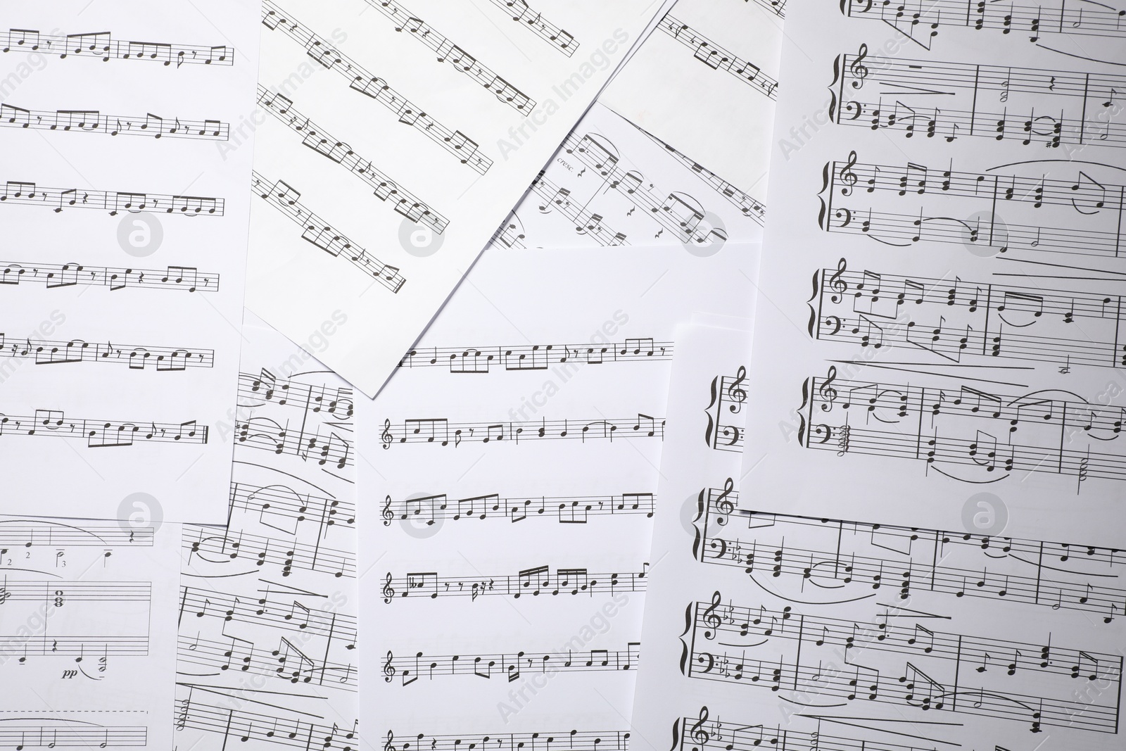 Sheets with musical notes as background, top view Photo of Sheets with musical notes as background, top view
