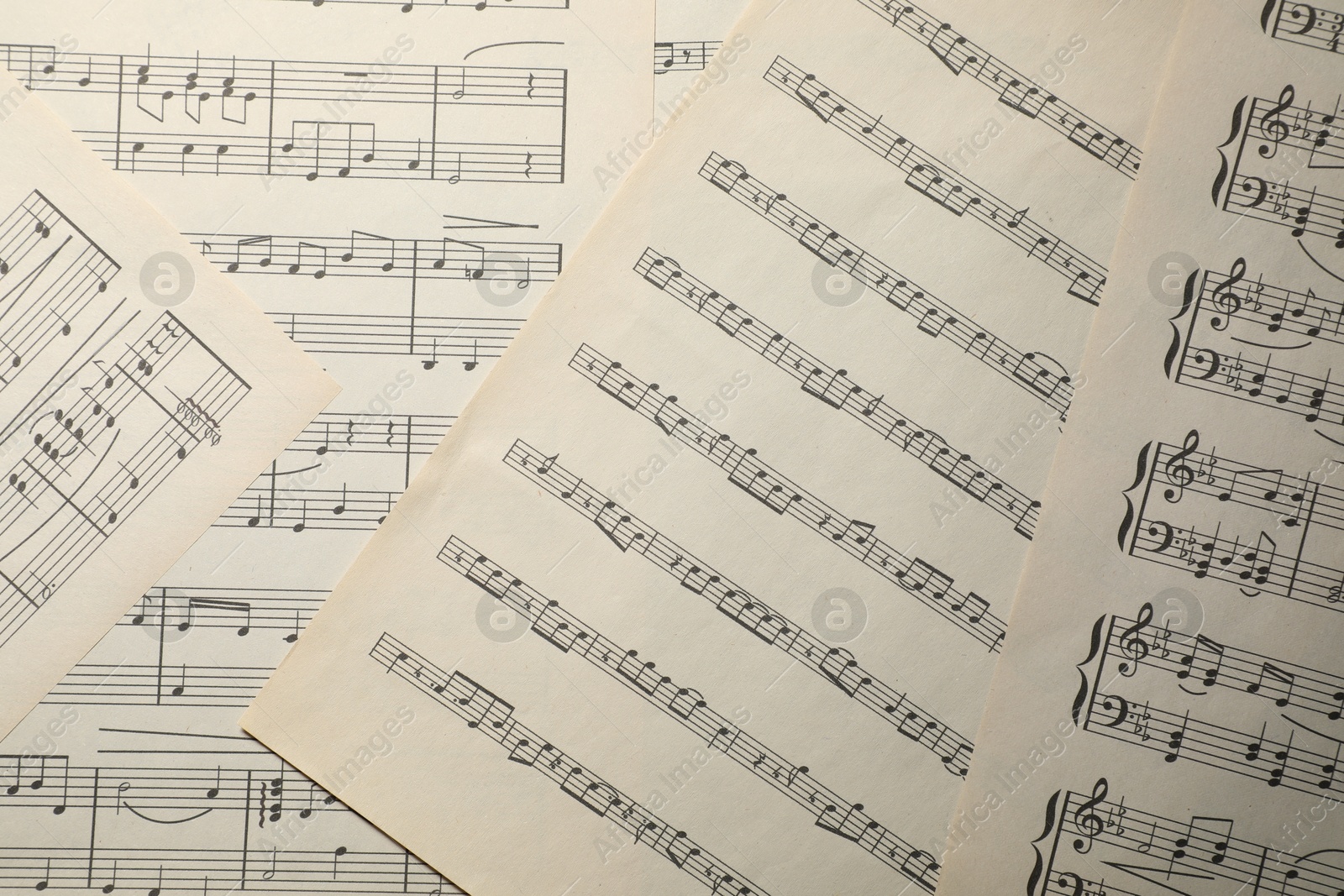 Sheets with musical notes as background, top view Photo of Sheets with musical notes as background, top view