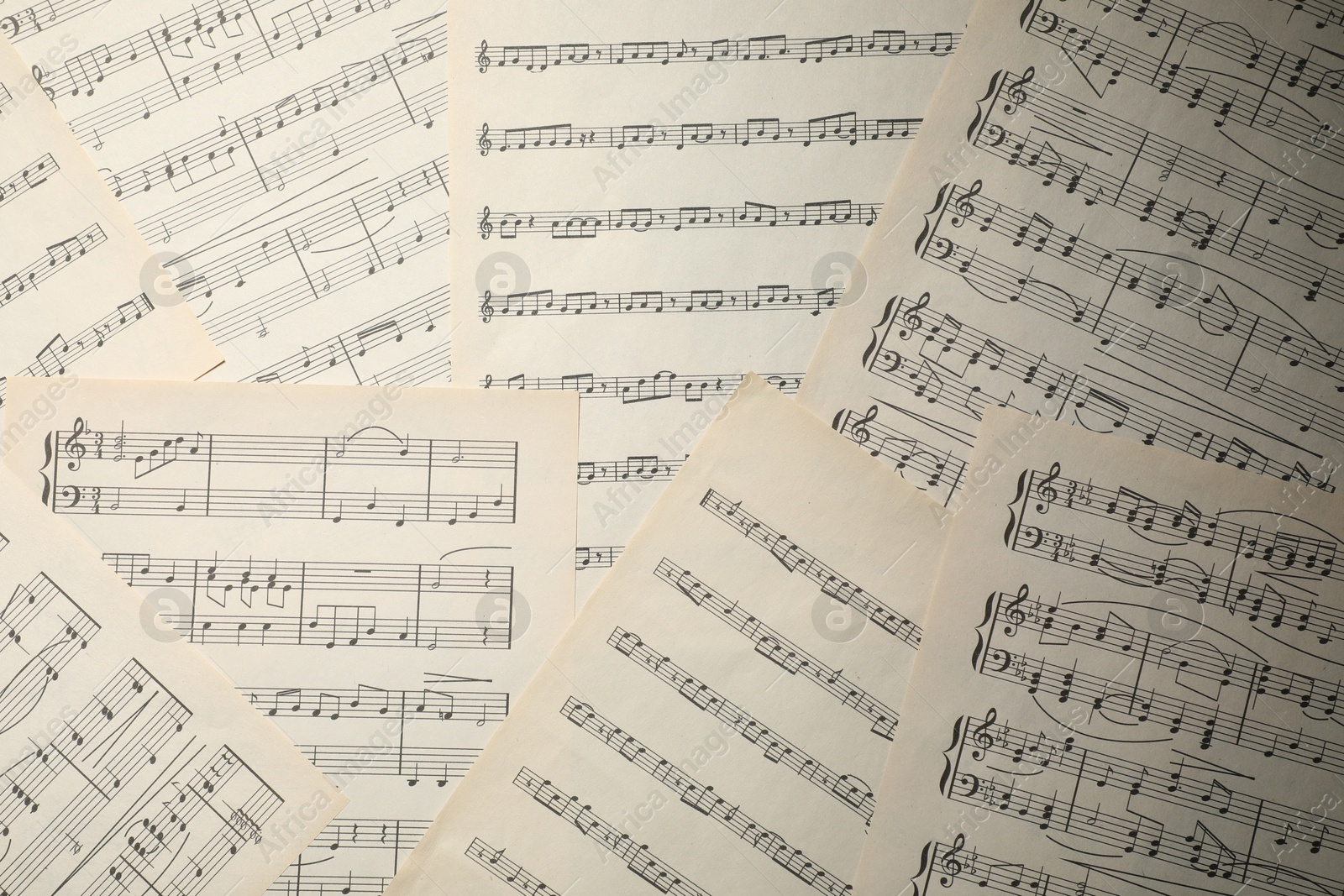 Sheets with musical notes as background, top view Photo of Sheets with musical notes as background, top view