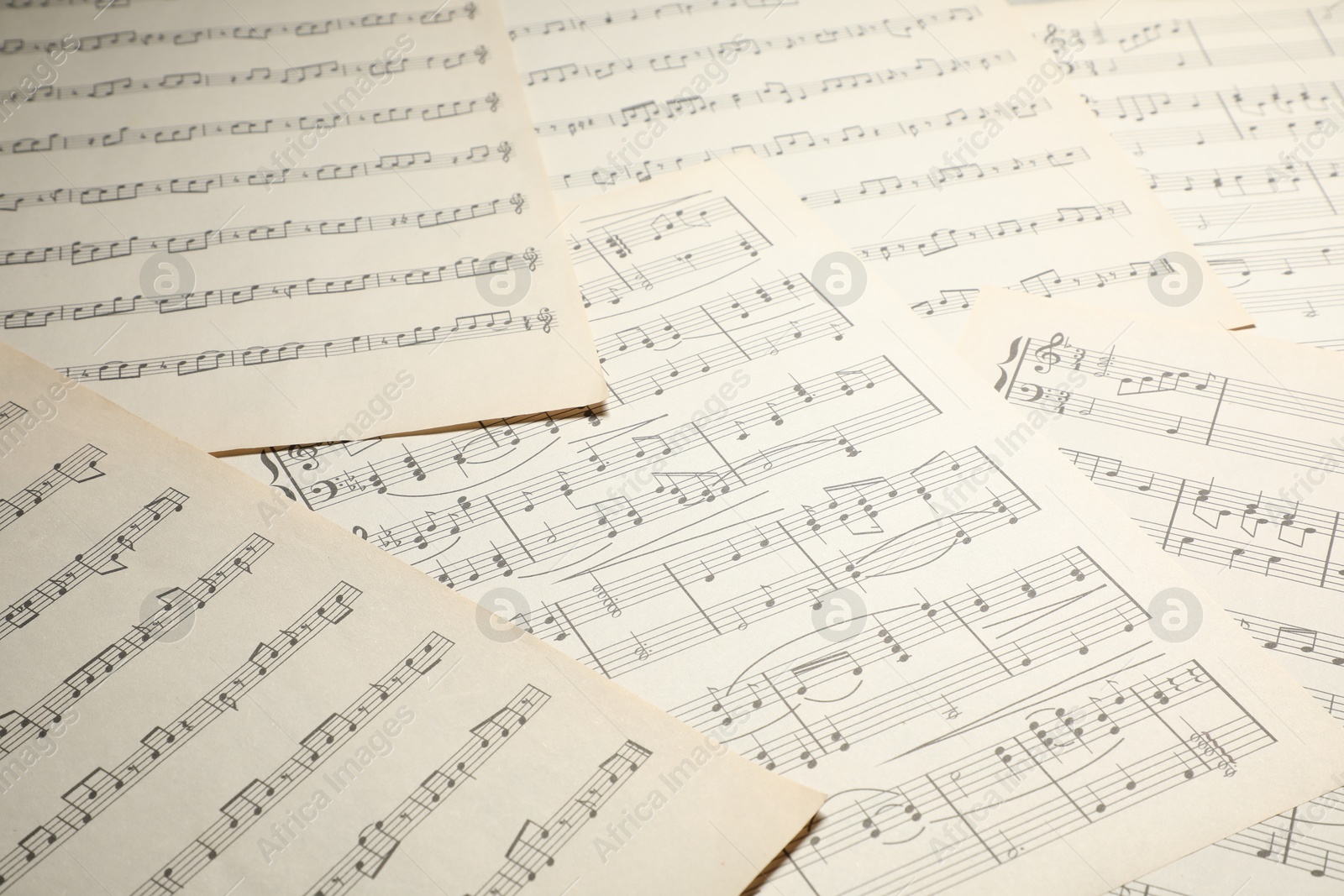Sheets with musical notes as background, closeup Photo of Sheets with musical notes as background, closeup