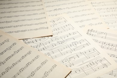Photo of Sheets with musical notes as background, closeup