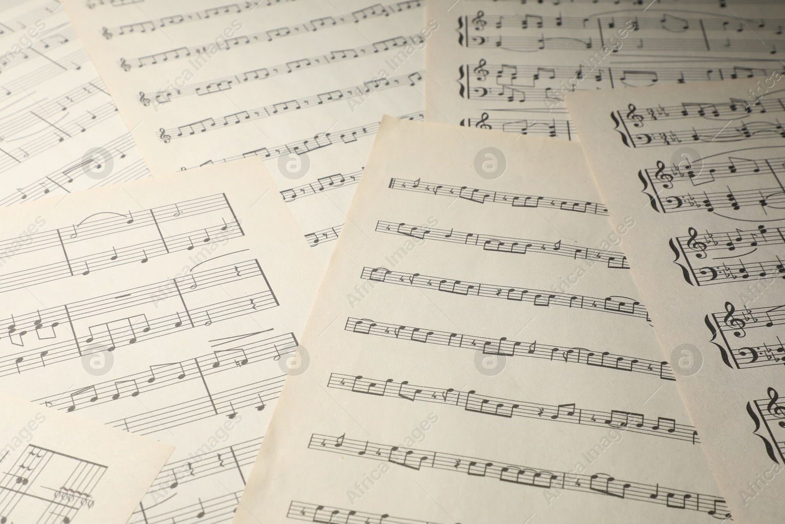 Sheets with musical notes as background, closeup Photo of Sheets with musical notes as background, closeup