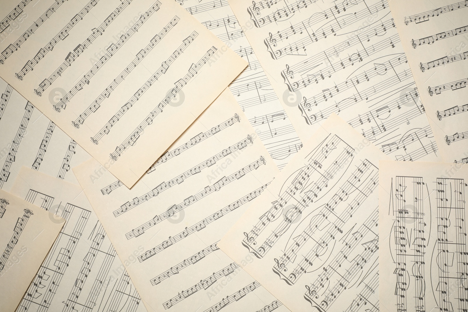 Sheets with musical notes as background, top view Photo of Sheets with musical notes as background, top view