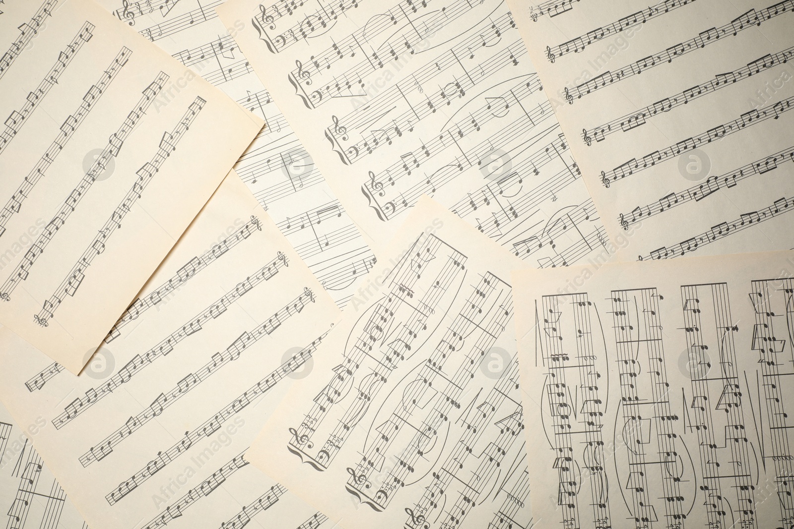 Sheets with musical notes as background, top view Photo of Sheets with musical notes as background, top view