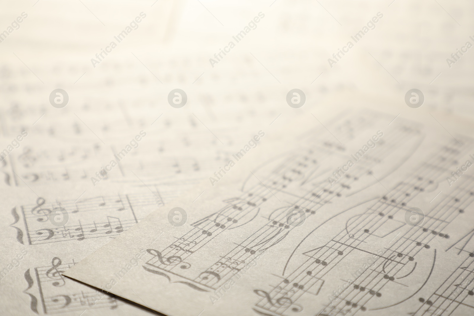 Sheets with musical notes as background, closeup Photo of Sheets with musical notes as background, closeup