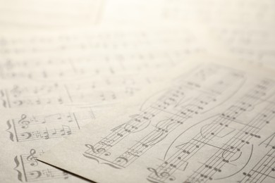 Photo of Sheets with musical notes as background, closeup
