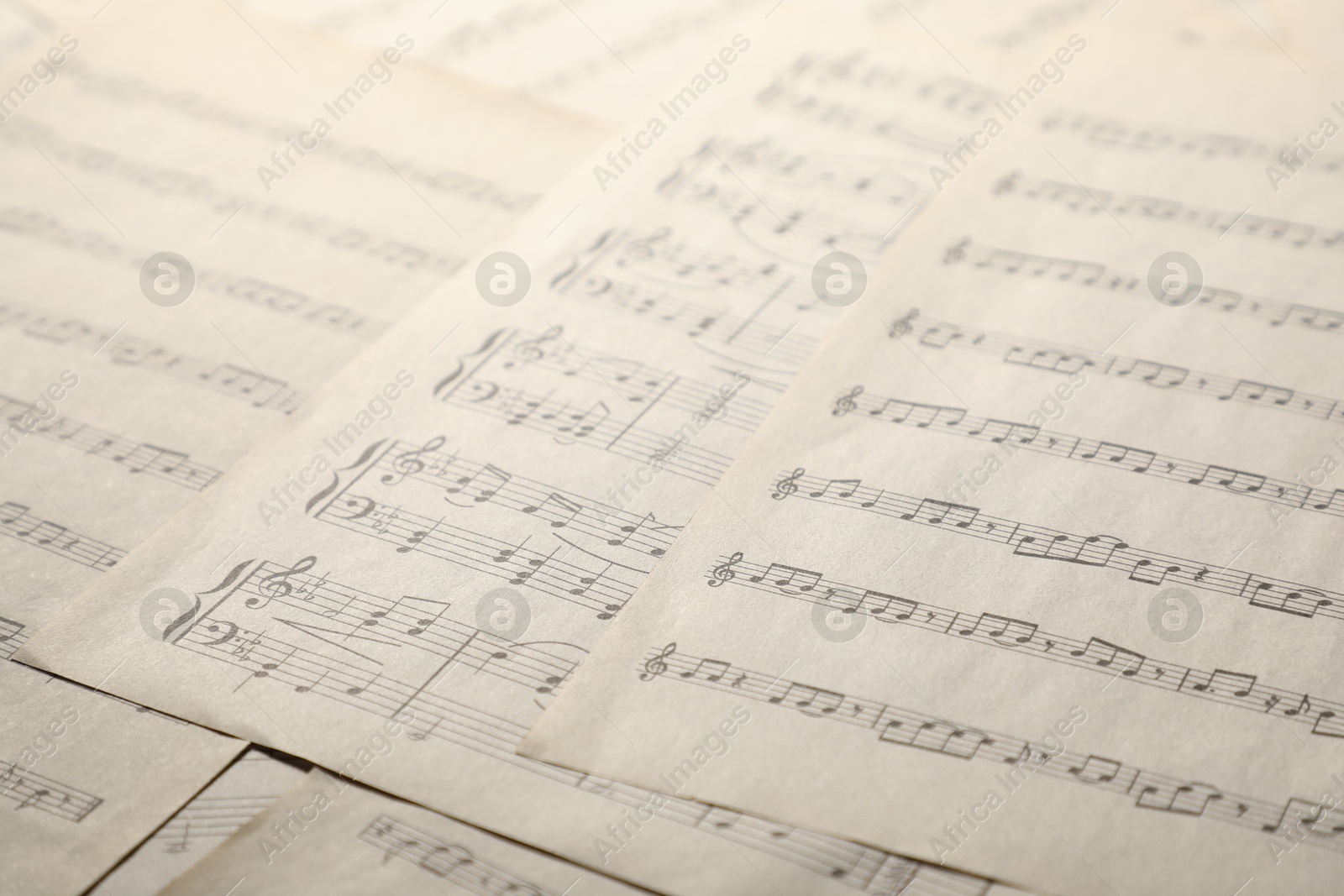 Sheets with musical notes as background, closeup Photo of Sheets with musical notes as background, closeup