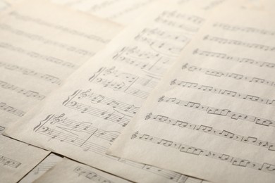 Photo of Sheets with musical notes as background, closeup