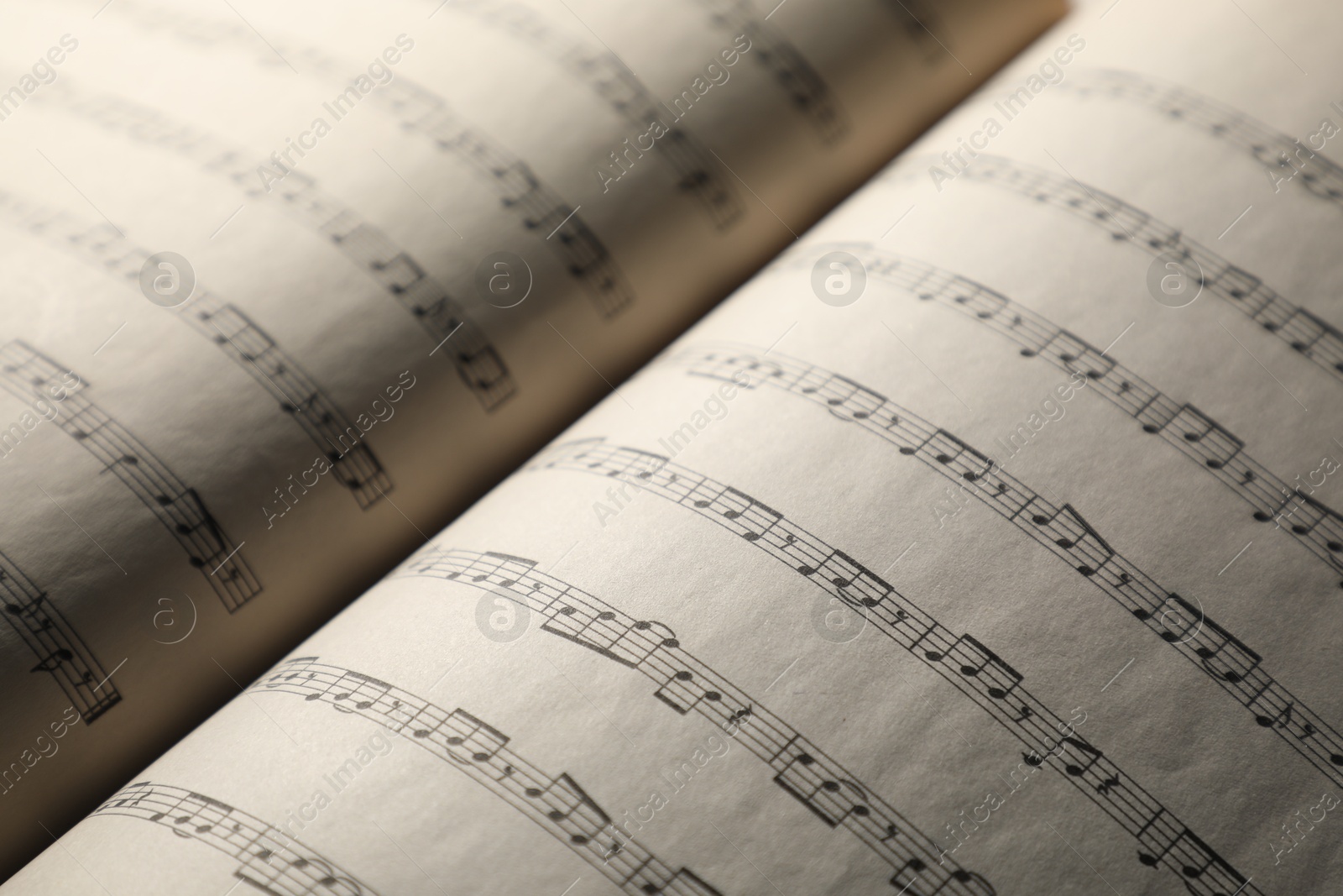 Sheets with musical notes as background, closeup Photo of Sheets with musical notes as background, closeup