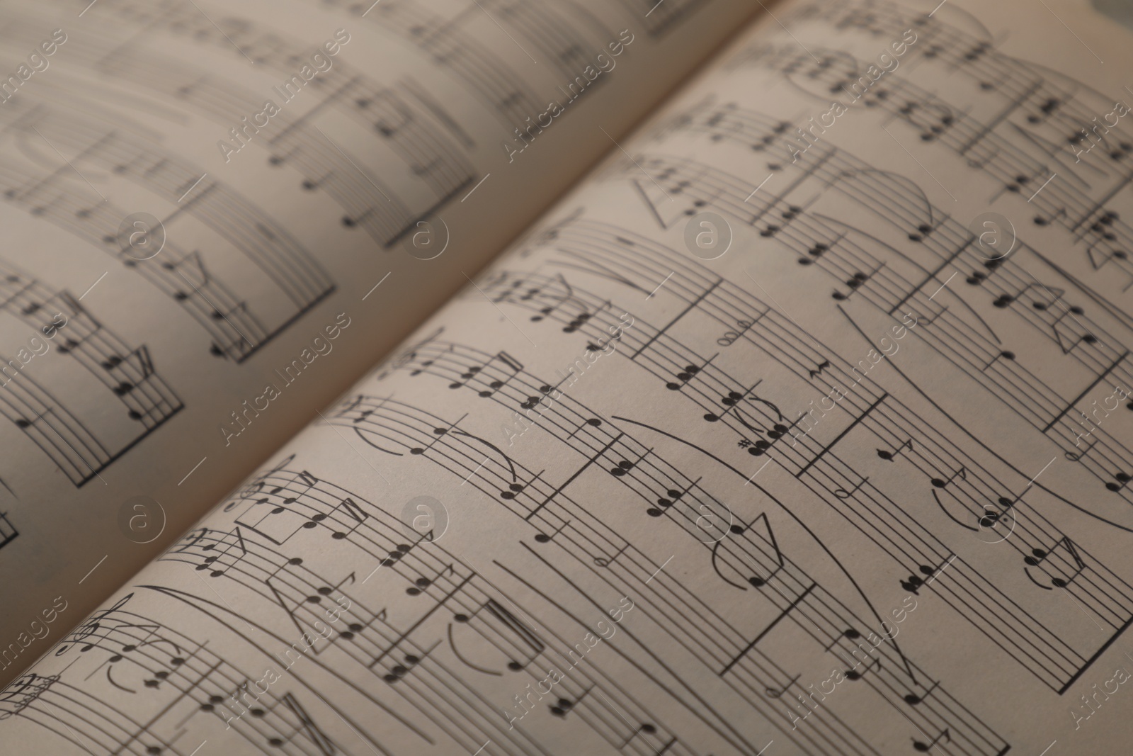 Sheets with musical notes as background, closeup Photo of Sheets with musical notes as background, closeup
