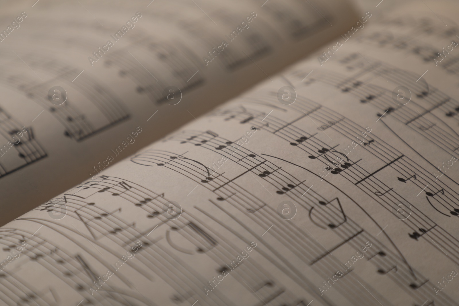 Sheets with musical notes as background, closeup Photo of Sheets with musical notes as background, closeup
