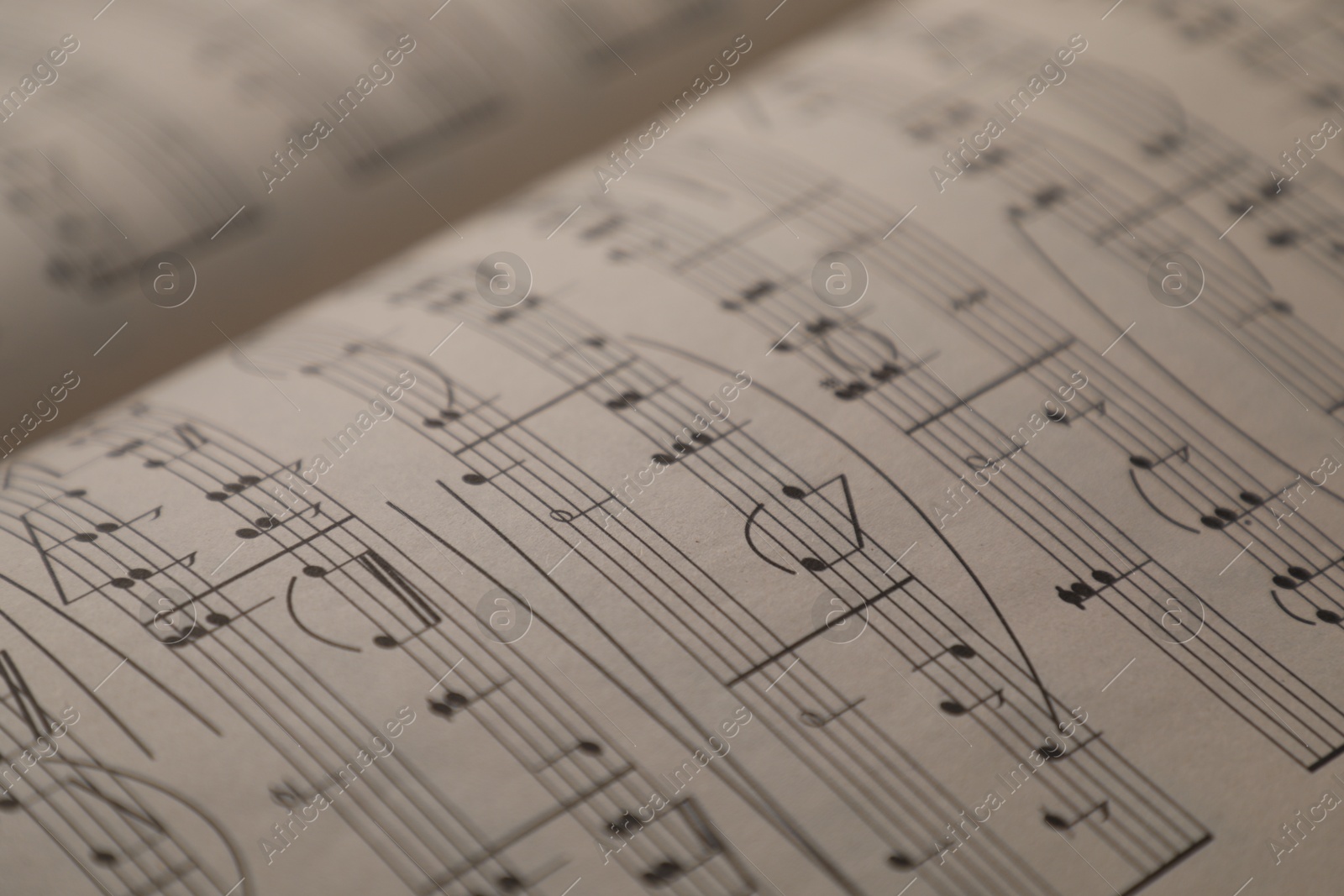 Sheets with musical notes as background, closeup Photo of Sheets with musical notes as background, closeup
