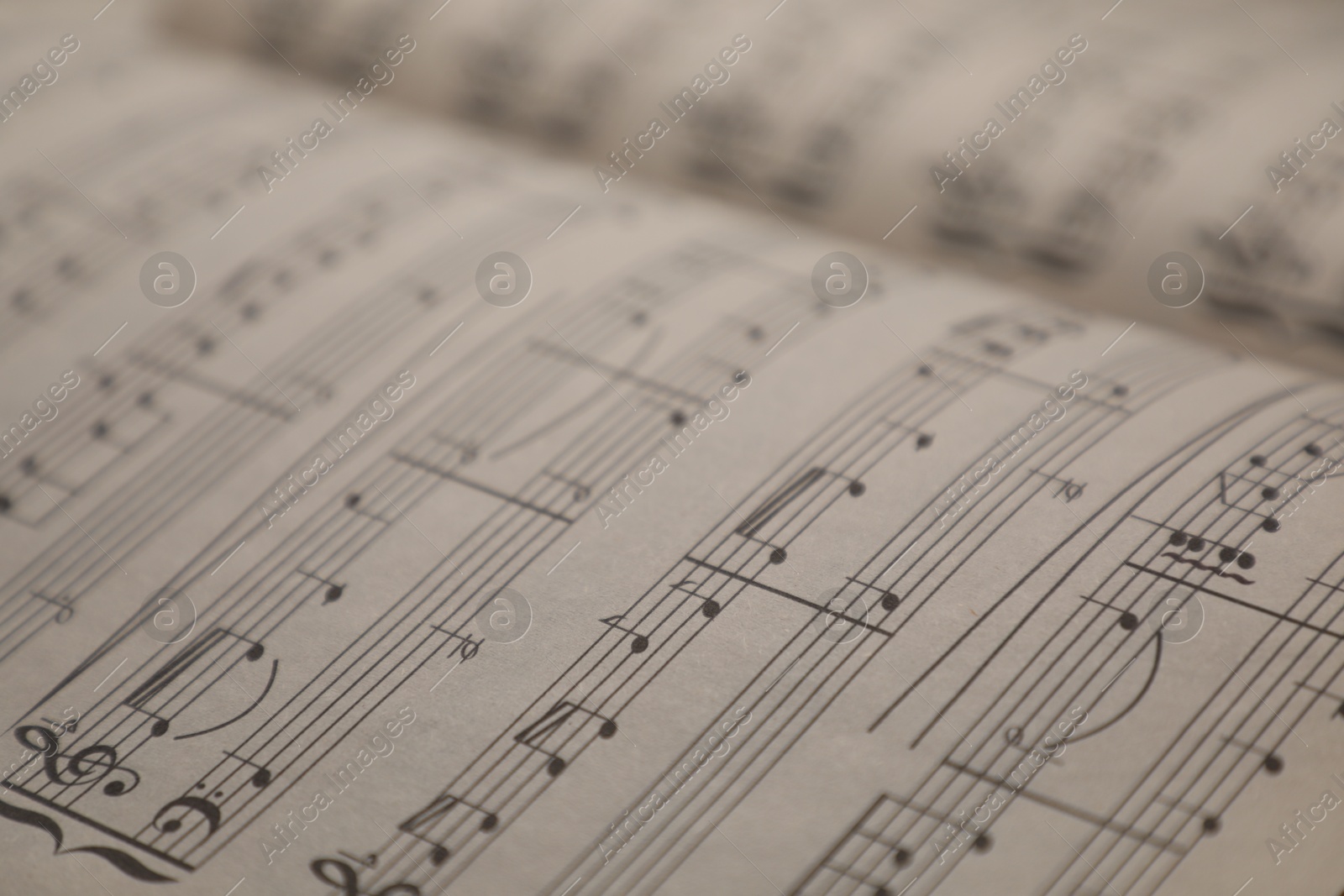 Sheets with musical notes as background, closeup Photo of Sheets with musical notes as background, closeup