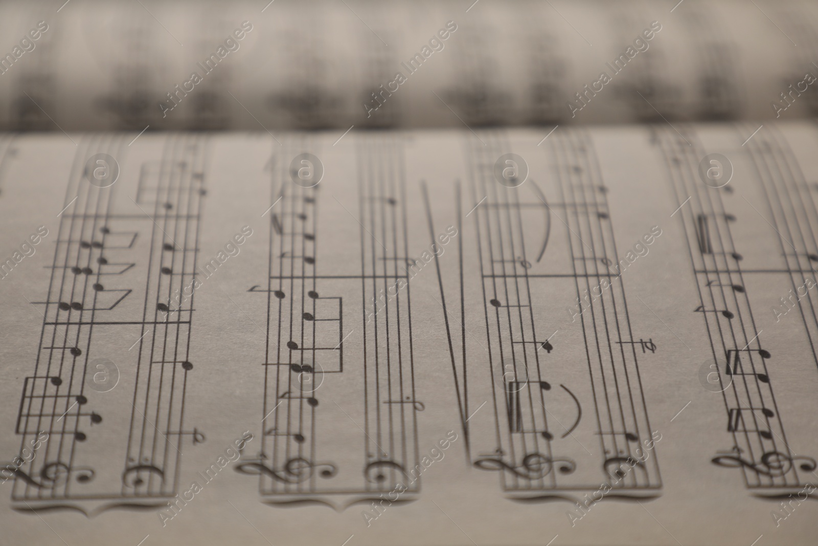 Sheets with musical notes as background, closeup Photo of Sheets with musical notes as background, closeup