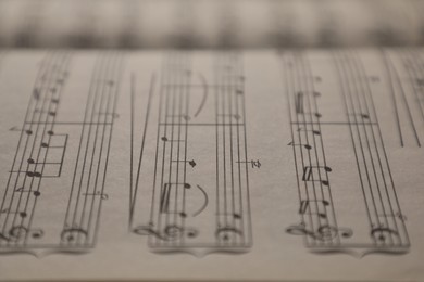 Photo of Sheets with musical notes as background, closeup