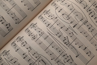 Photo of Sheets with musical notes as background, top view