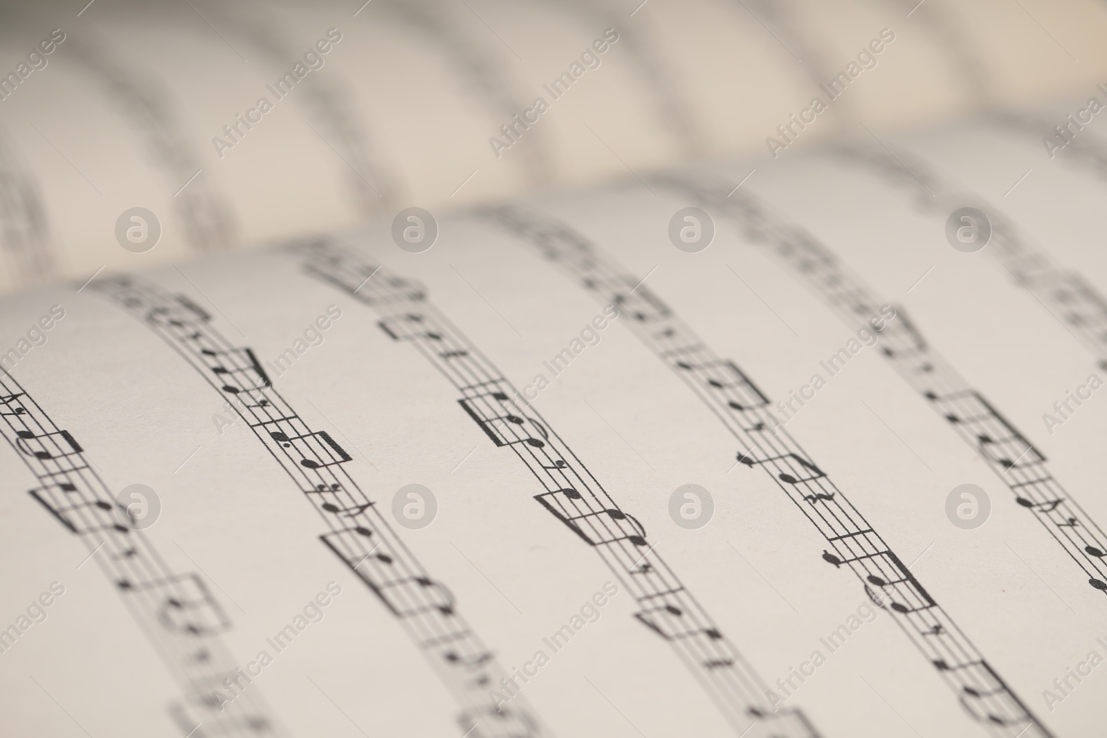 Sheets with musical notes as background, closeup Photo of Sheets with musical notes as background, closeup